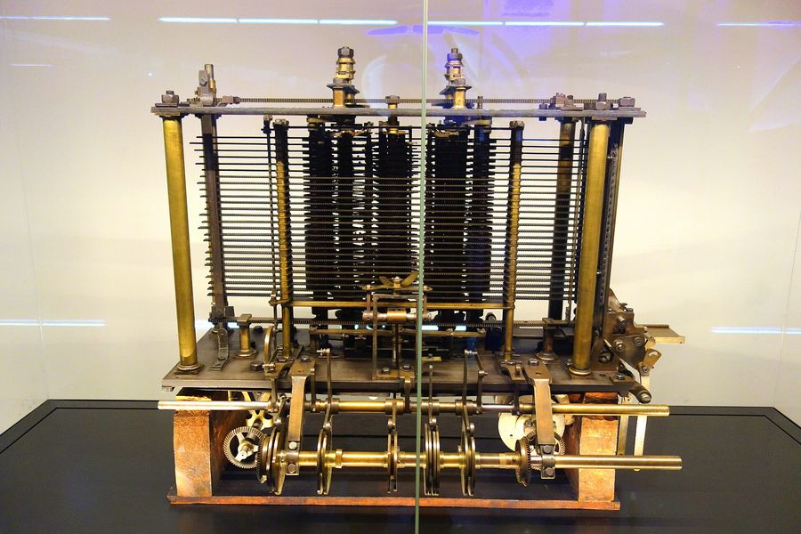 Babbage's trial model of the Analytical Engine: stacks of brass gear wheels in a glass case