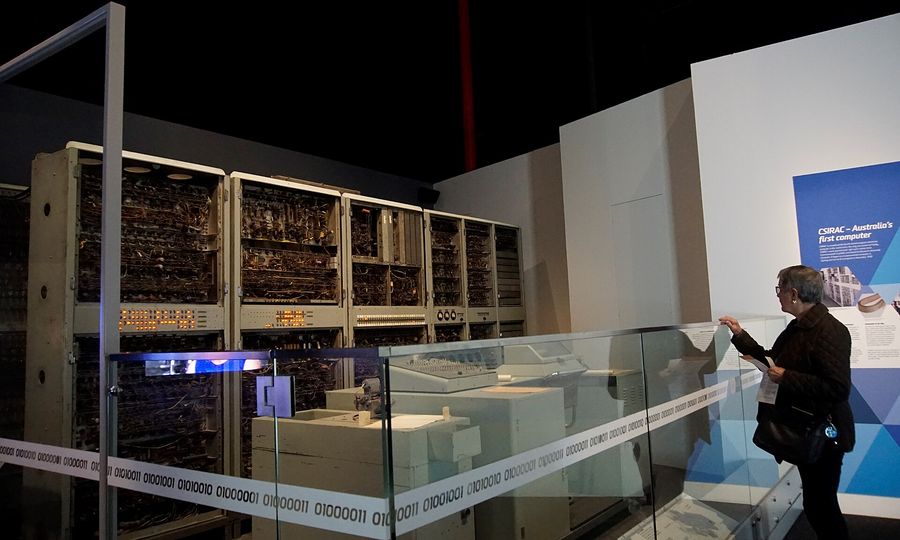 CSIRAC, Australia's first computer: rows of grey cabinets and a control console on display in a museum