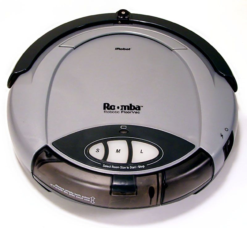 The original 2002 Roomba robot vacuum, a round grey and silver disc