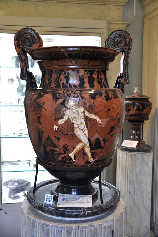 An ancient Greek red-figure vase showing the death of Talos, the bronze giant, held up by the figures around him