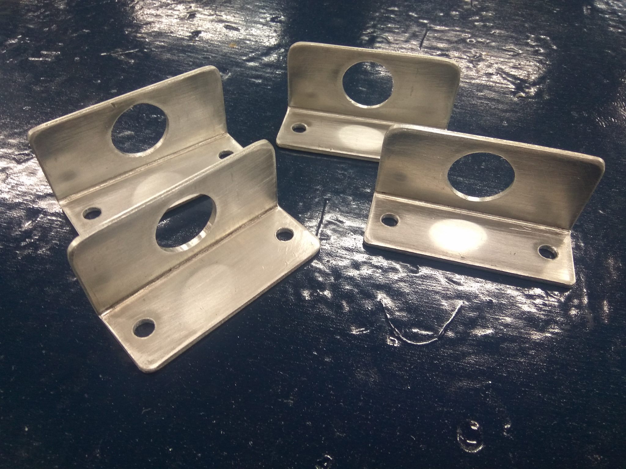A set of custom brackets fabricated in the workshop