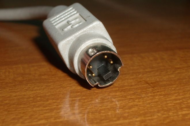 An ADB plug: a round four-pin mini-DIN