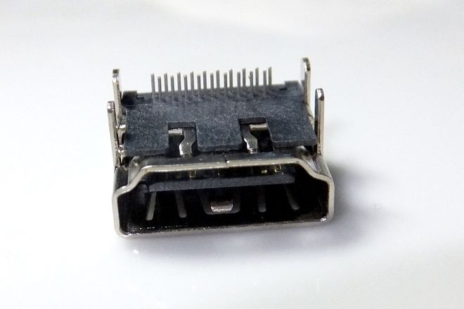 A bare HDMI socket component, showing the central tongue