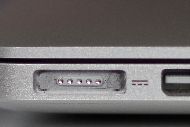 The MagSafe 2 port on a MacBook Pro, beside two Thunderbolt ports