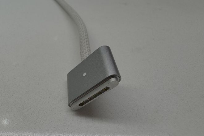 A MagSafe 3 plug on a braided cable