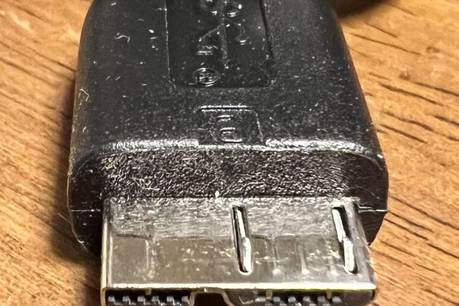A USB 3.0 Micro-B plug: a wide two-part plug