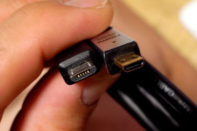 A USB Micro-B plug and a Micro HDMI plug held side by side
