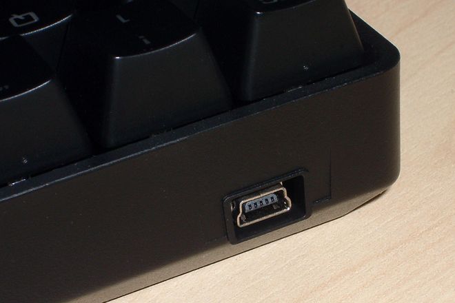 A USB Mini-B port on the back of a keyboard