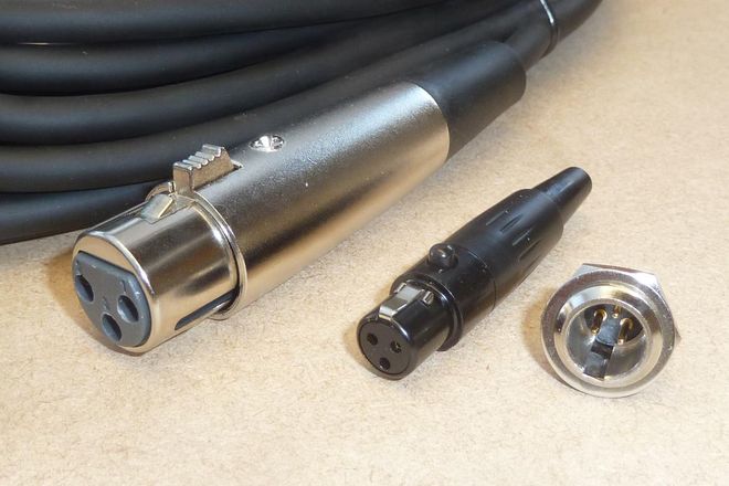 A full-size XLR connector beside two mini XLR connectors