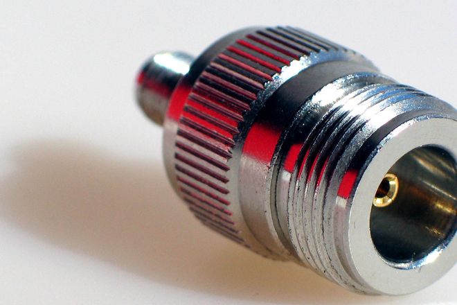 An N-type socket on an adapter: a threaded barrel with a centre contact for the plug's pin
