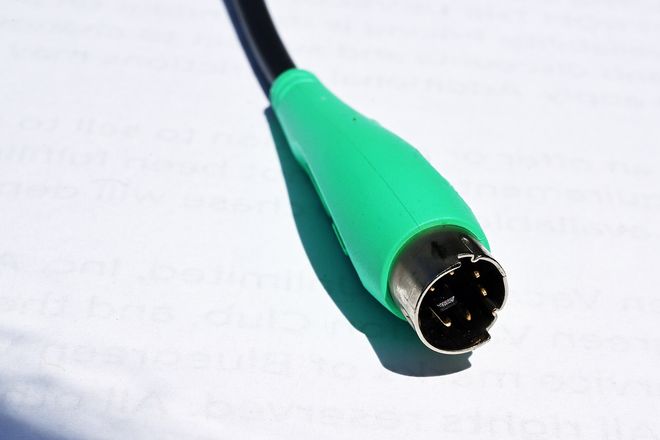 A green PS/2 mouse plug showing its six pins