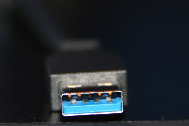 A USB 3.0 Type-A plug with a blue plastic tongue