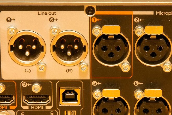 Male XLR output sockets and female XLR input sockets on a rack unit