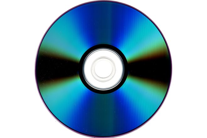 The silver data side of a pressed CD, showing the rainbow sheen