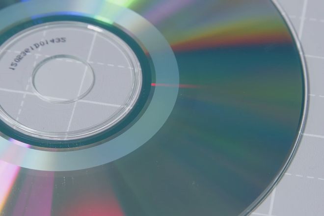 The coloured dye side of a recordable CD, with the edge of the written area visible