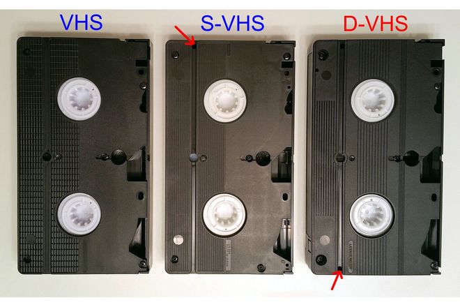 The underside of VHS cassettes, showing the identification holes