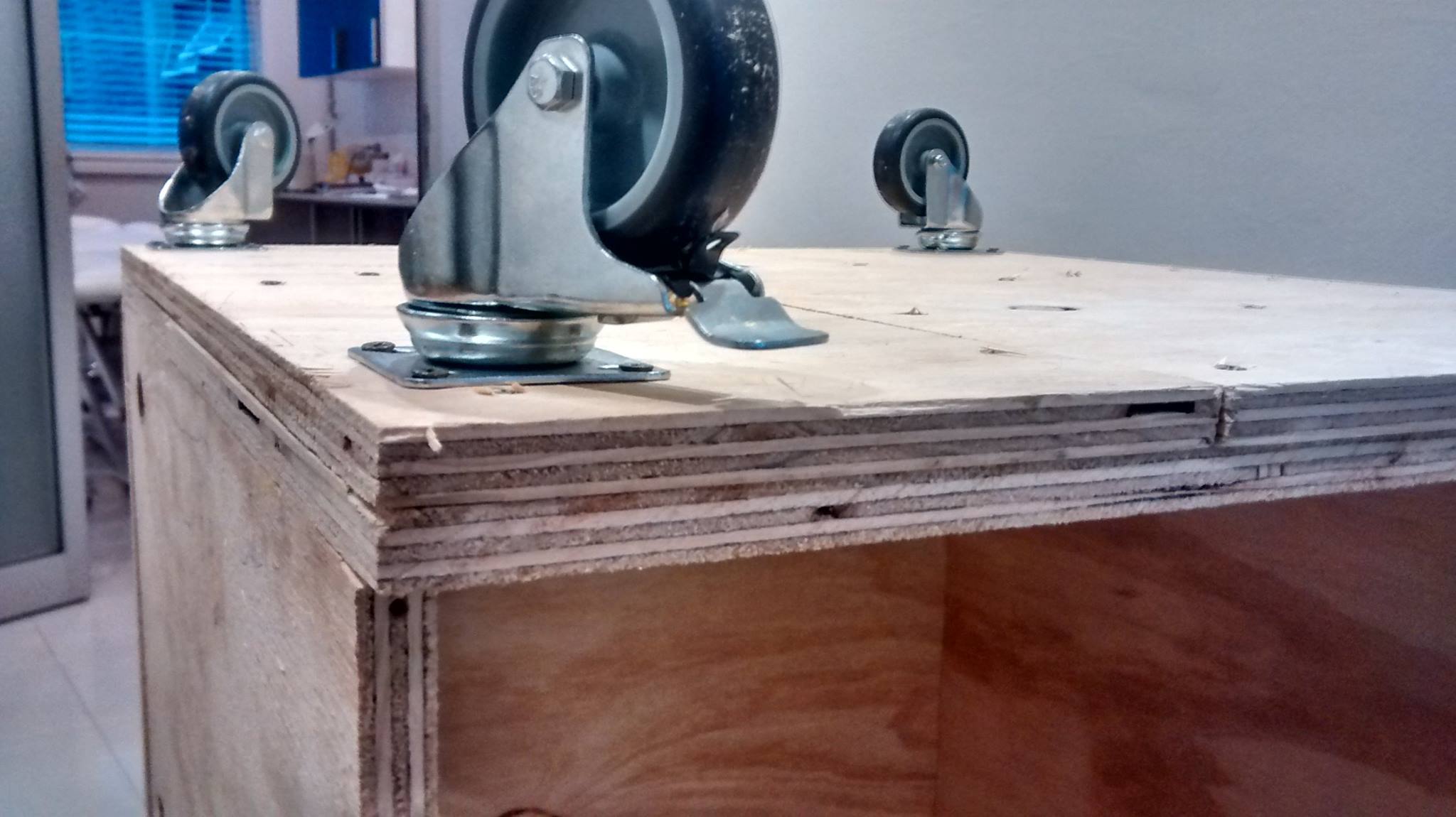 Custom timber shipping box fitted with castors for ease of movement